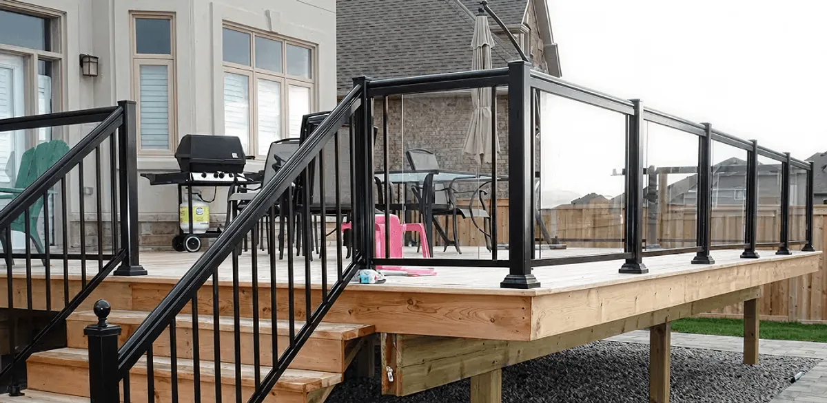 Handrail installation on a deck staircase for safety and code compliance in Fargo, ND