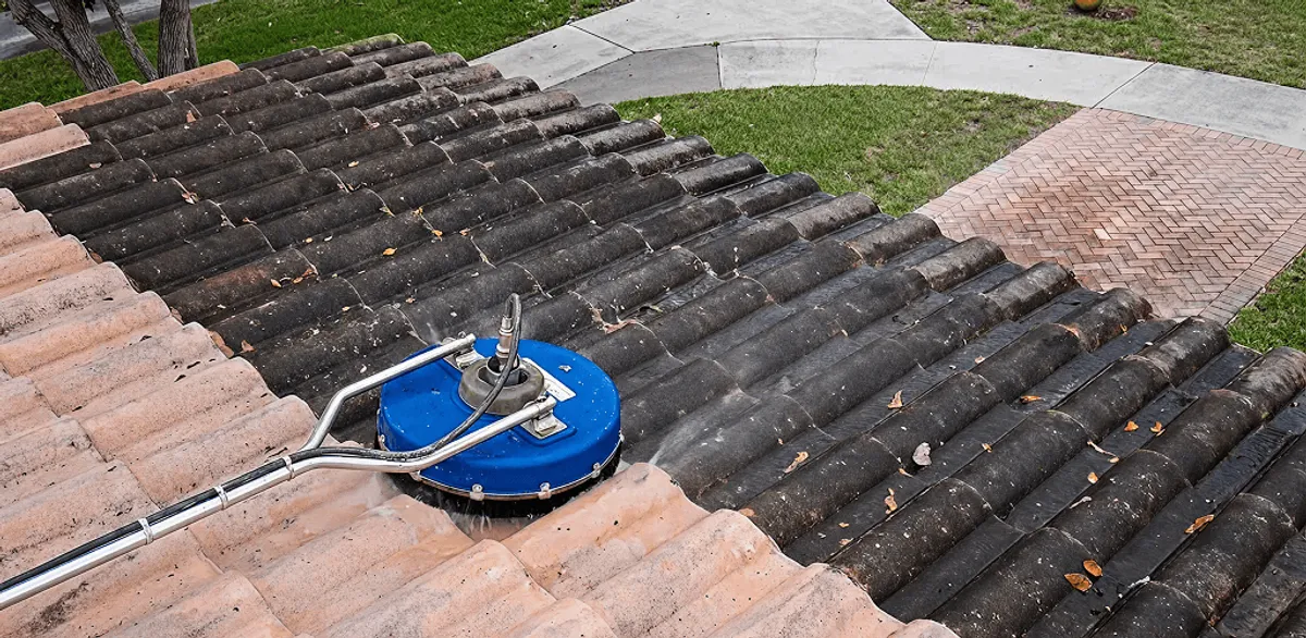 Roof pressure cleaning removing debris and buildup from roof tiles in Fargo, ND